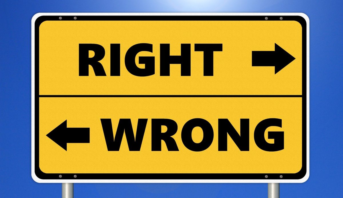 Image shows sign with 'right' pointing right and 'wrong' pointing left