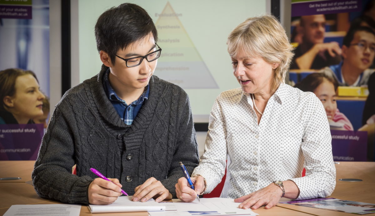 Student taking part in a one-to-one writing tutorial with a Skills Centre writing tutor