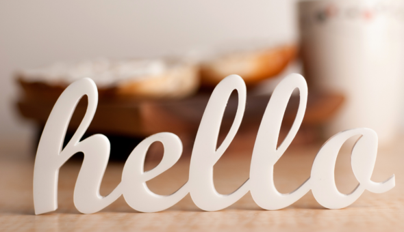 Table ornament spelling out the word 'hello' in cursive font.