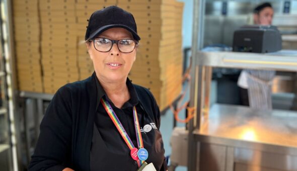 Rachael standing by the pizza counter in lime tree.