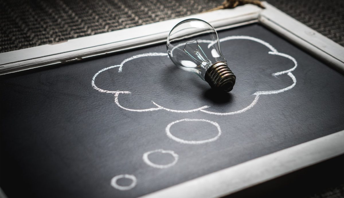 Lightbulb on a blackboard with a thought bubble