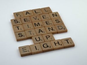letters that state "Fall seven times stand up eight"