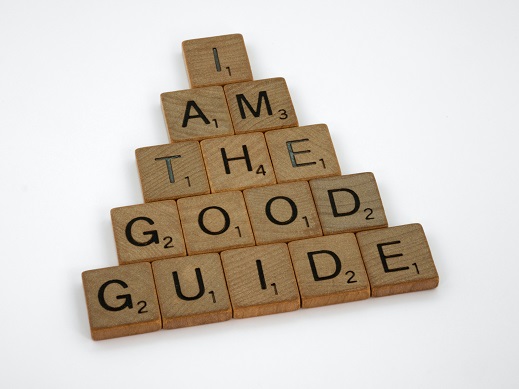 Scrabble letters saying in a pyramid "I am the good guide"