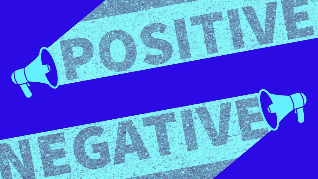 Graphic of two megaphones facing each other, one is transmitting the word “positive”, the other the word “negative.”