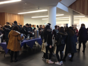 Newly arrived students getting to know each other over tea and coffee.