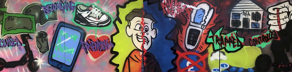 Mural of graffiti artwork. In the centre of the mural, a young person’s face is split down the middle, happy on the left with attractive items shown including new trainers, friendship, and lots of cash. On the right side, the face is in fear. Items on the right show insistent texts on a ‘burner’ mobile, a trap house and a big fist controlling a silhouette of a person with a ball and chain.