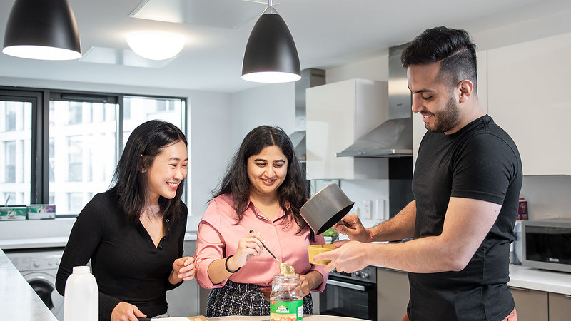 A group of students cooking together