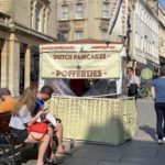 A cream-coloured stand with the words "Dutch Pancakes - Poffertjes"