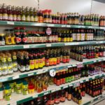 Rows of colourful bottles containing Eastern sauces and condiments.