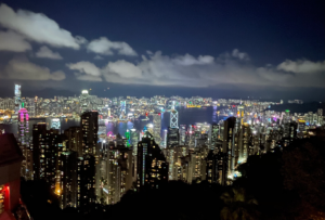 The Hong Kong skyline at night-time with buildings lit up