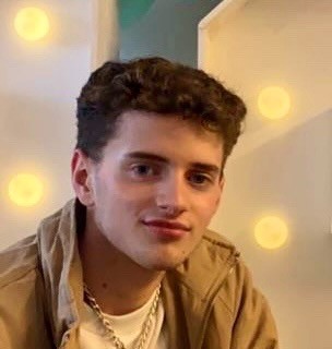 Head and shoulders photo of Connor who has short cropped brown hair and brown eyes