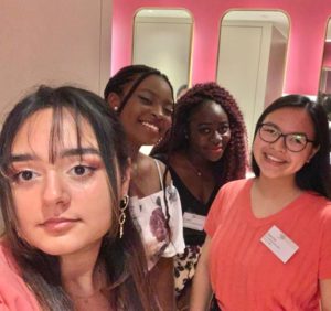 A selfie of Gina (author of blog) and her friends, smiling into camera. 