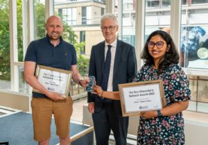 Gavin and Pooja receiving an award from the VC